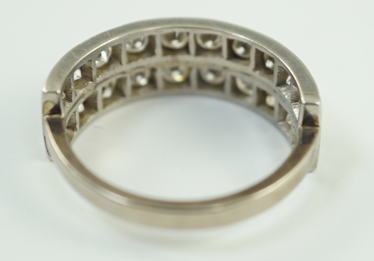 A white gold and two row twenty stone diamond set half eternity ring